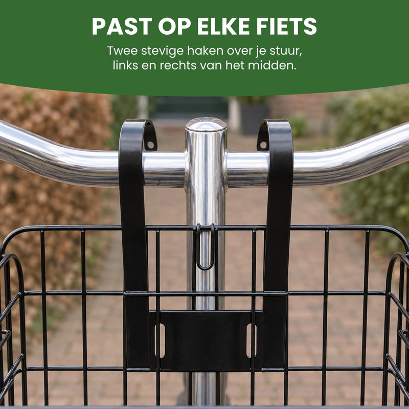 Zwei flache schwarze Haken des Trego-Fahrradkorbs über dem Lenker eines Stadtrads, links und rechts vom Vorbau: passt an jedes Fahrrad